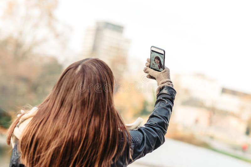 Beautiful Woman Making A Self Photo With Smart Phone Stock Image