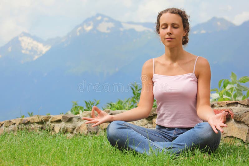 Beautiful woman is meditating. royalty free stock photo