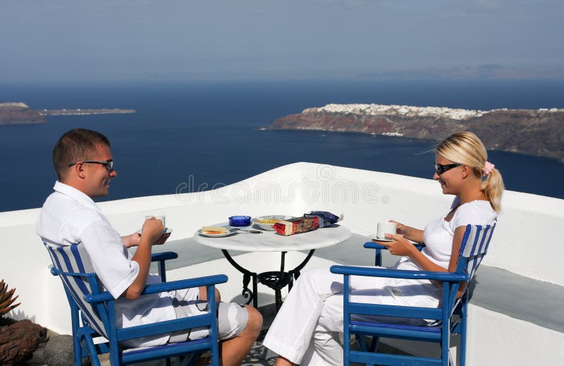 Beautiful woman and men sitting on the balcony