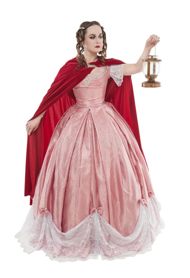 Beautiful woman in old historic medieval dress with lantern isolated stock image Beautiful woman in old historic medieval dress with lantern isolated stock image