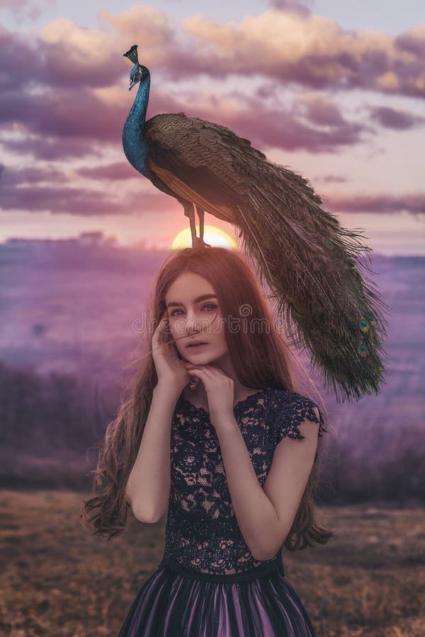 Beautiful woman with peacock photoshoot