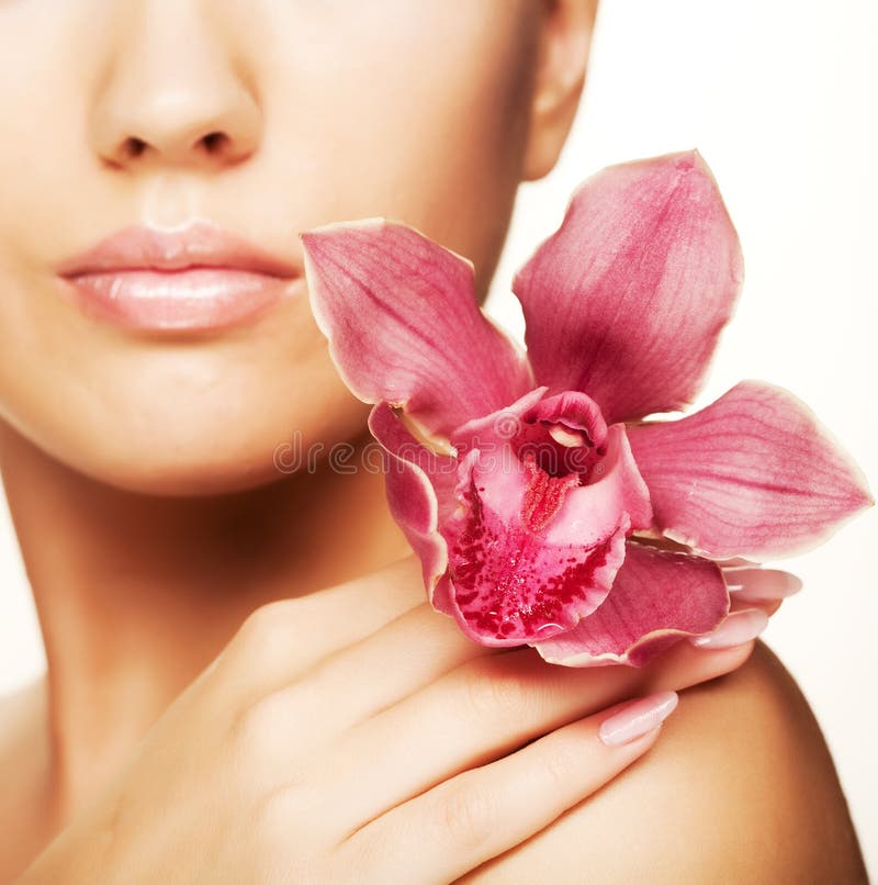 Beautiful woman with pink flower