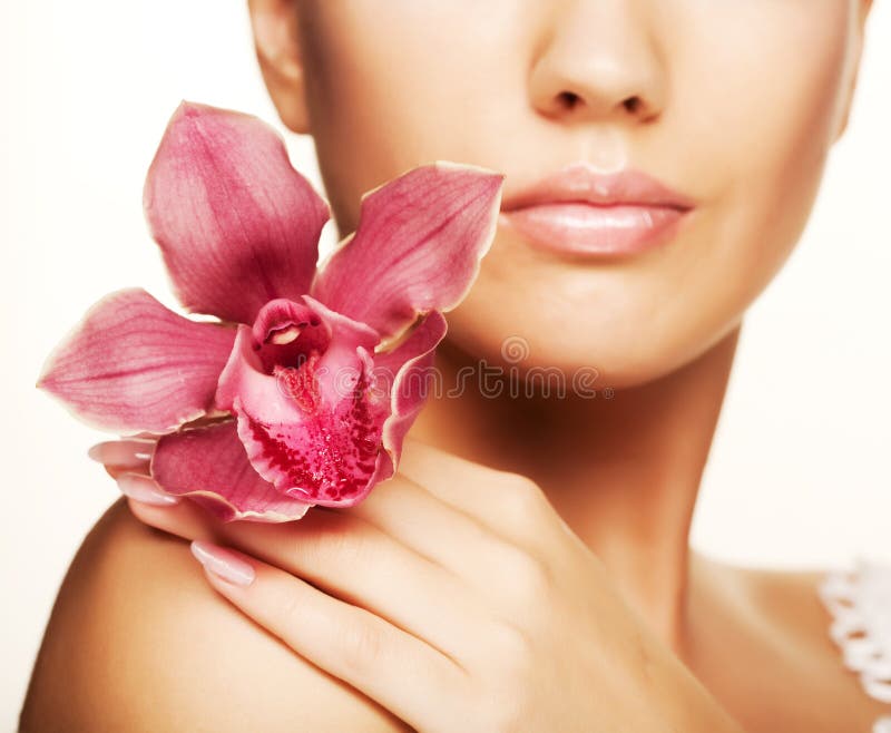 Beautiful woman with pink flower