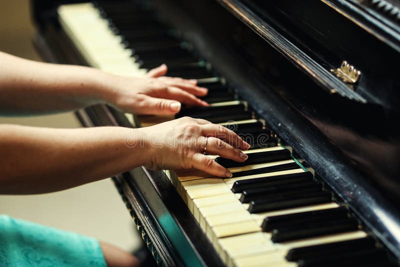 Beautiful Woman Playing Piano,Close Up of Woman Hands Playing Pi Stock