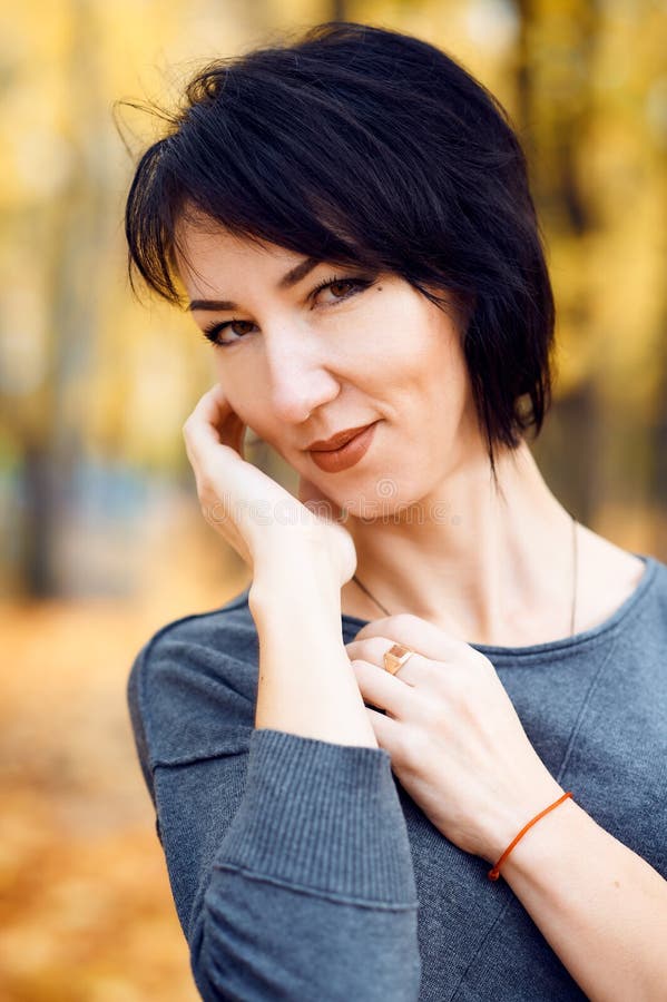 Beautiful woman portrait in autumn city park, fall season, yellow leaves stock image Beautiful woman portrait in autumn city park, fall season, yellow leaves stock image