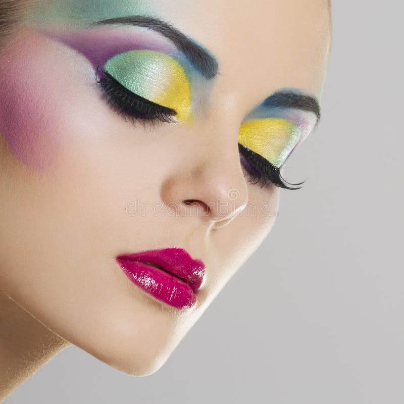 Beautiful woman portrait with bright colourful makeup