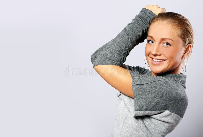 Beautiful woman posing over gray background