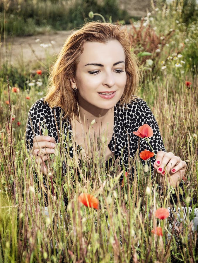 Beautiful Woman Posing in Poppy Flowers Field, Beauty, Fashion a Stock ...