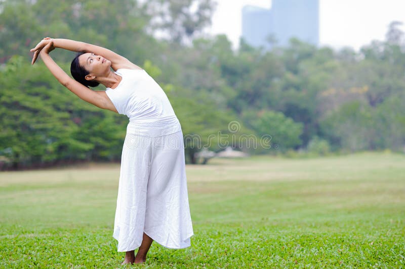 Beautiful woman practicing yoga in the park royalty free stock images Beautiful woman practicing yoga in the park royalty free stock images