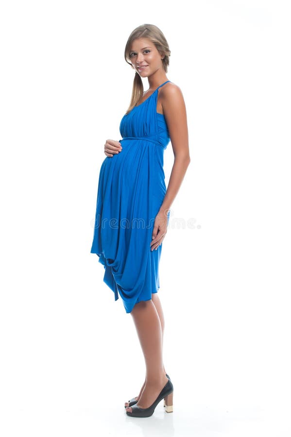 Beautiful Woman Pregnant model in blue dress on white isolated background posing. Clothes for pregnant women