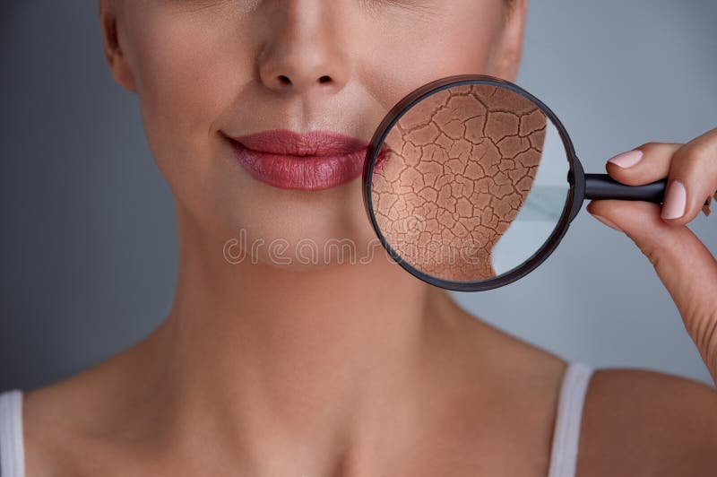 Face of a beautiful woman with a problem on skin and magnifier. Problem wrinkle stock images, royalty-free photos and pictures