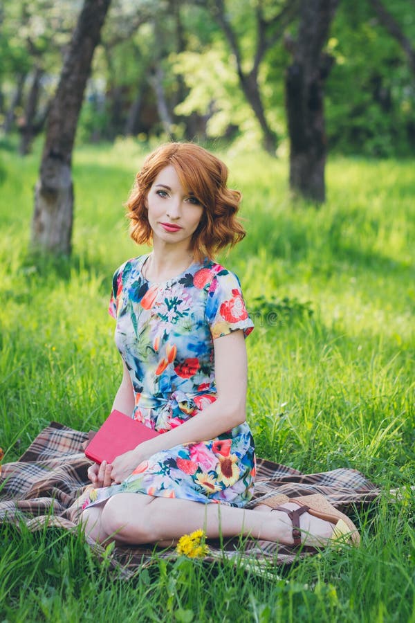 Beautiful Woman Reading a Book in the Spring Garden Stock Photo - Image ...