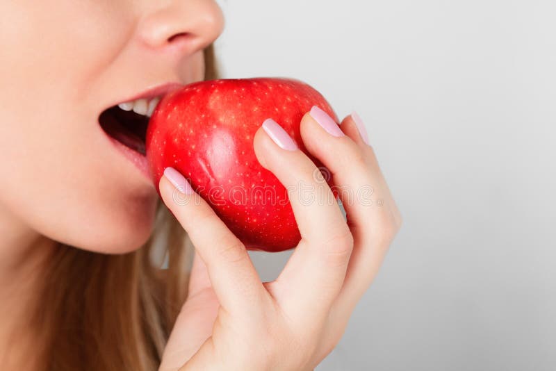 Beautiful woman with red apple