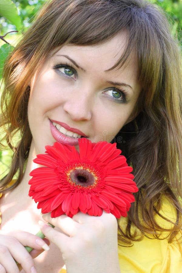 Beautiful woman with red flower