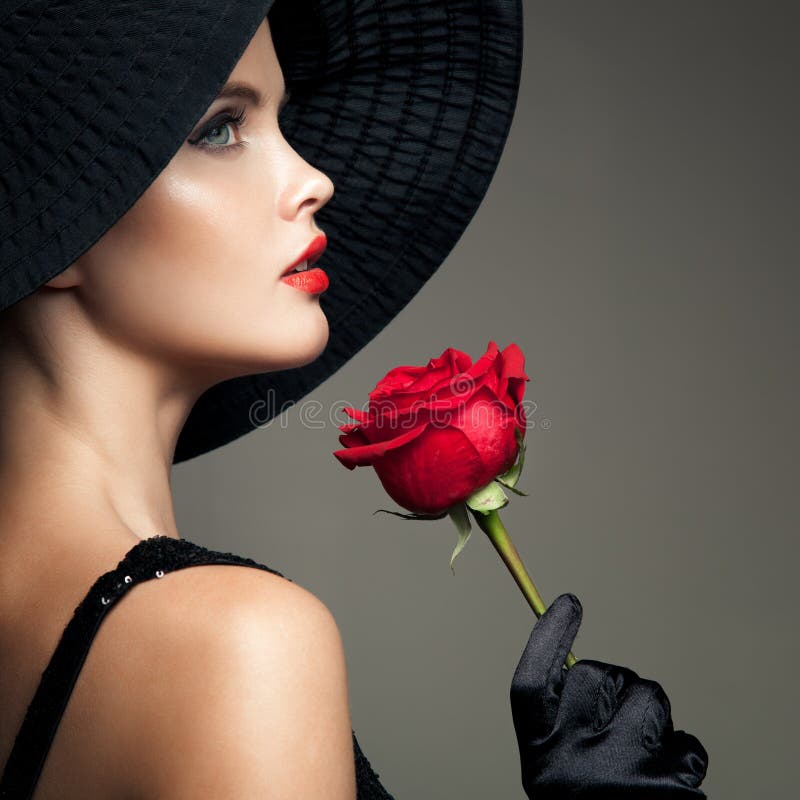 Beautiful Woman With Red Rose. Retro Fashion Image.