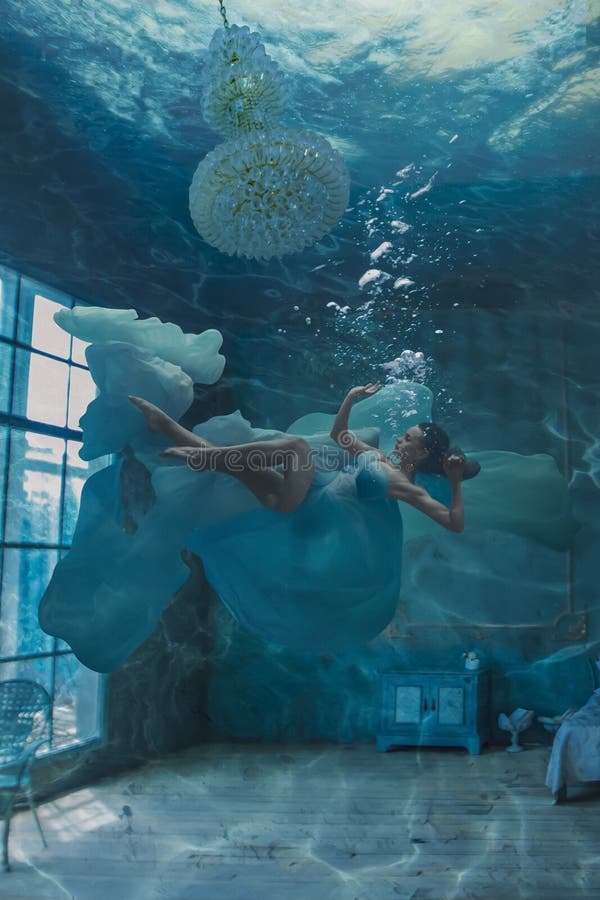 Beautiful woman in room underwater portrait  photoshoot