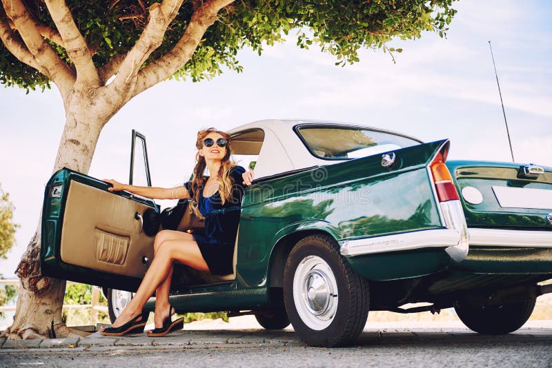 Beautiful woman sitting in a car