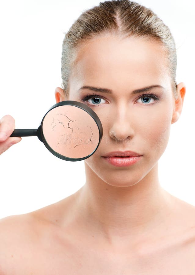 Beautiful woman, skin close up with a magnifying glass, over a white background. Problem wrinkle stock images, royalty-free photos and pictures