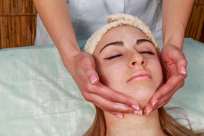 Beautiful woman at spa procedure. Enjoying, cosmetic.