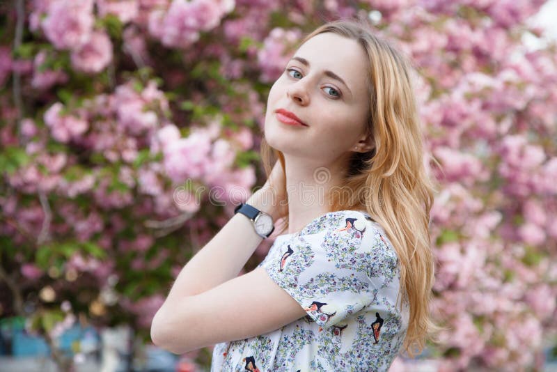 Beautiful woman in spring blossom