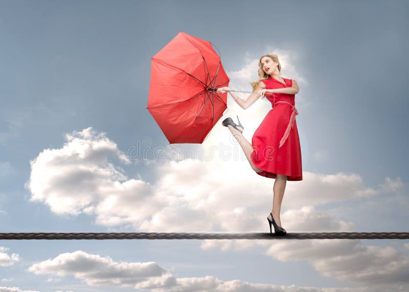 Beautiful woman standing on rope stock photos