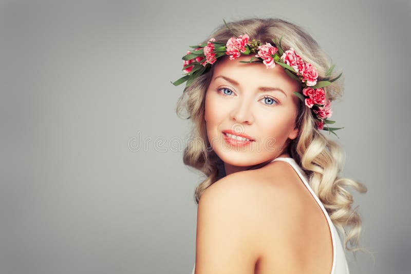 Beautiful Woman with Summer Pink Flowers. Blonde Beauty