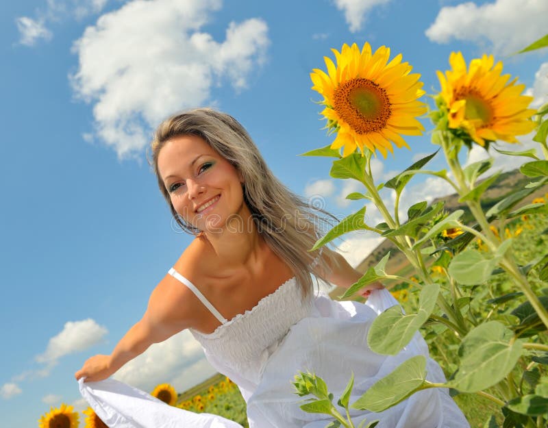 Beautiful woman on sunflower field