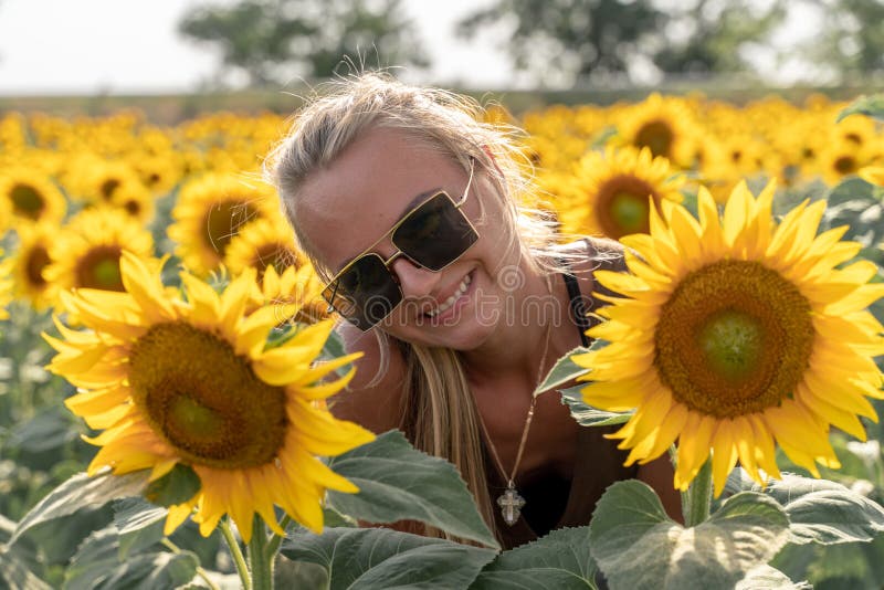 Blonde woman with sunflower in her hair - wide 8