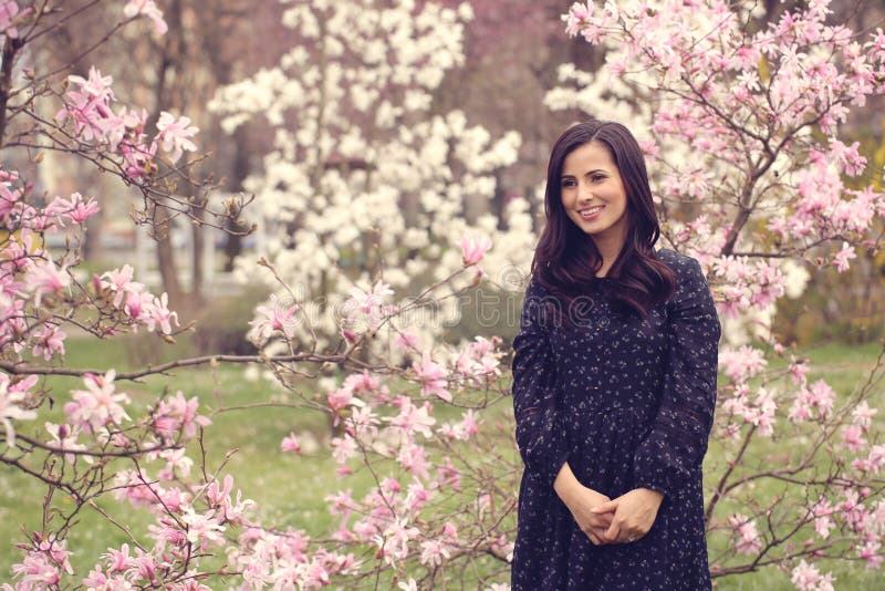 Beautiful woman surrounded by flowers royalty free stock images Beautiful woman surrounded by flowers royalty free stock images