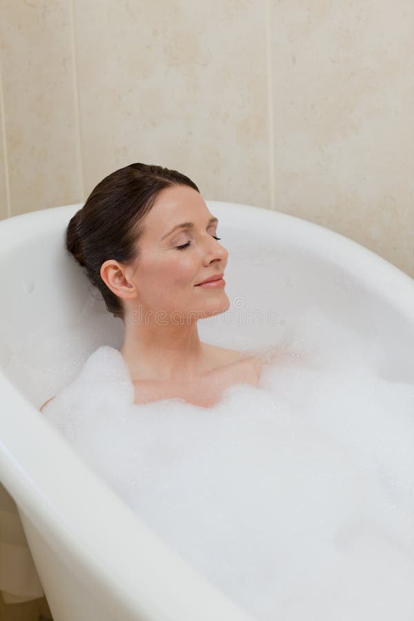 Beautiful woman taking a bath royalty free stock photos