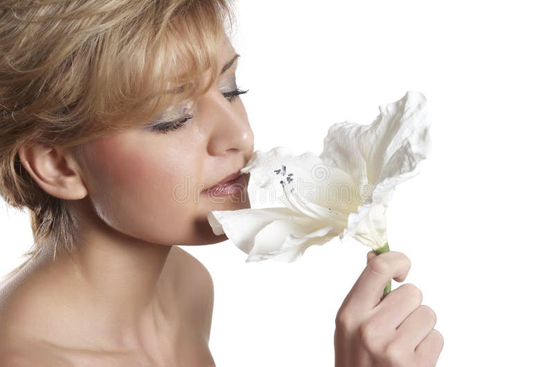 Beautiful woman to smell flower. close up