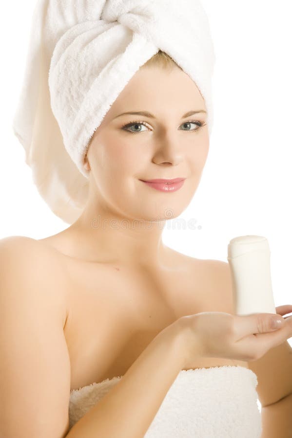 Beautiful woman in a towel with deodorant stick