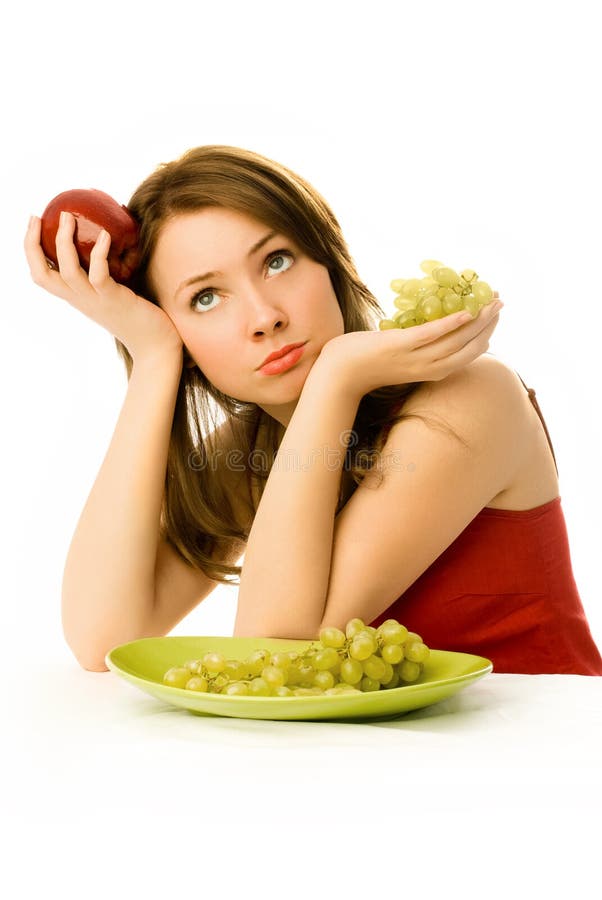 Beautiful woman unwilling to eat fruit