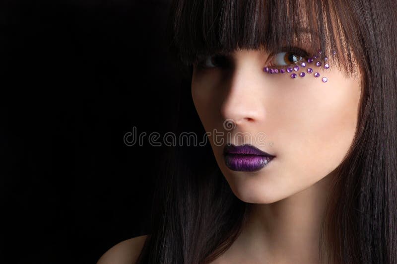 Beautiful woman with violet make-up