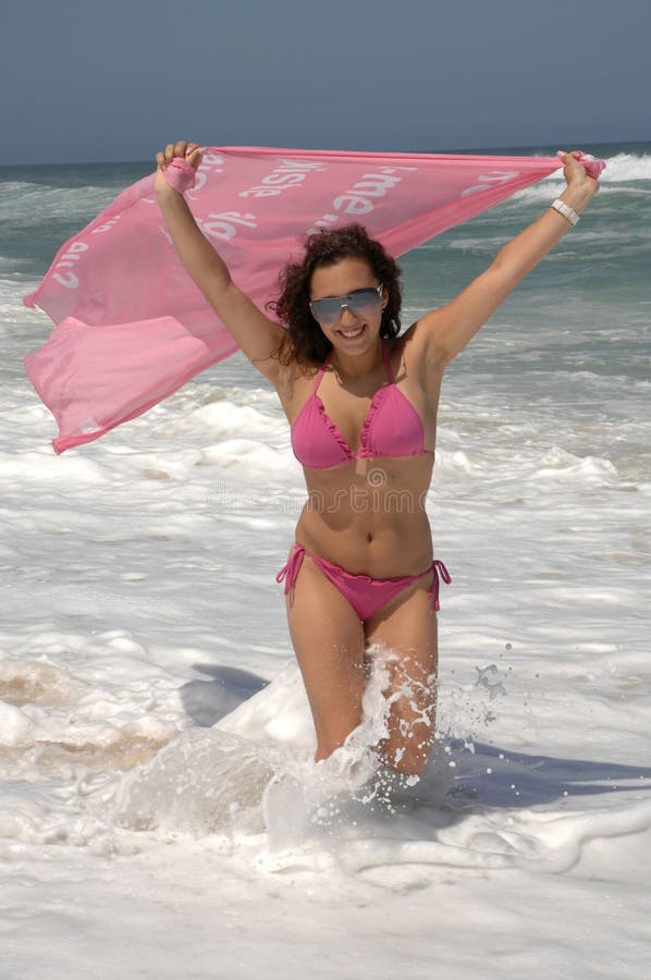 Beautiful woman walking on the beach