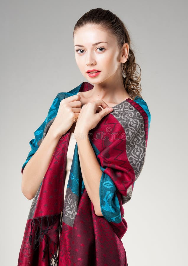 Beautiful woman wearing colorful kashmir scarf