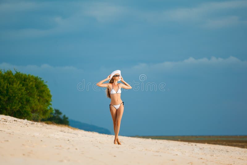 Beautiful woman wearing white bikini