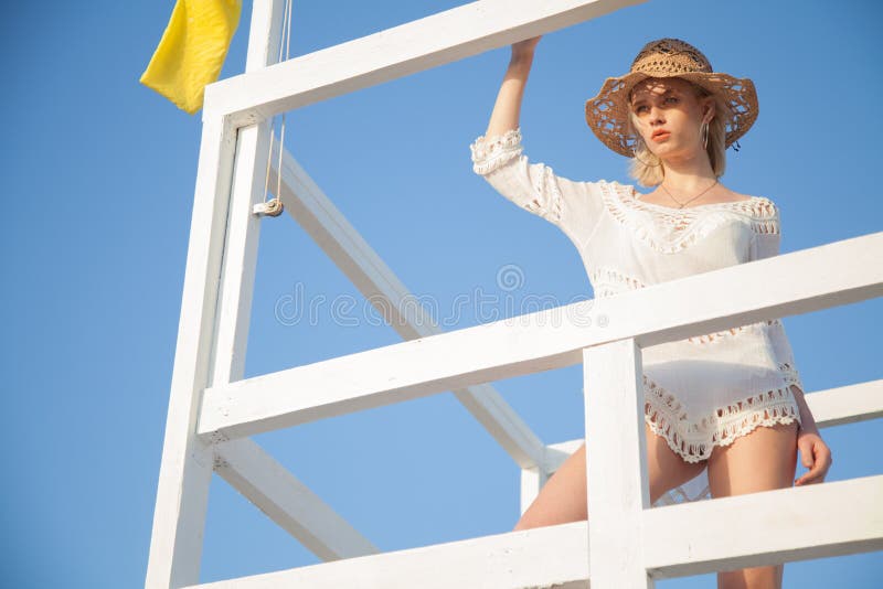 Beautiful Woman Rescuer In White Bathing Suit On The Beach Ocean Stock