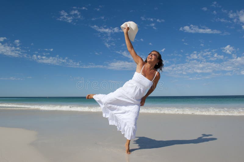 Beautiful Woman in White Dress at Beach