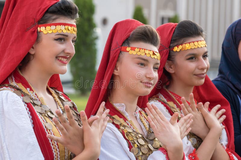 Beautiful women in traditional Albanian costumes posing for photo during annual Skopje festival of music and dance