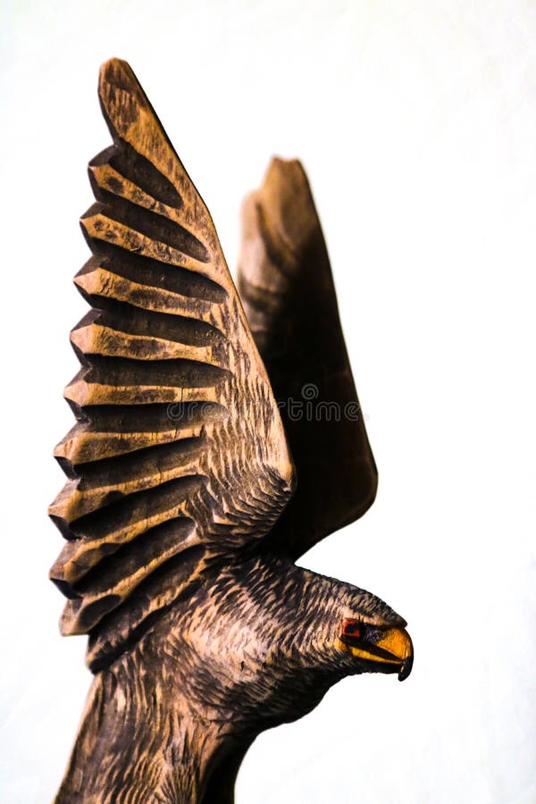 Beautiful Wooden Figure of an Eagle on a White Background Stock Image