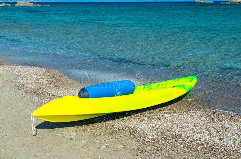 Yellow canoe on the beach stock photo. Image of seat 15783198