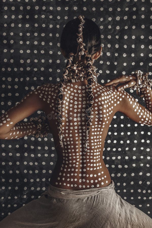 Beautiful young attractive fashionable model with traditional ornament on skin from the back. amazon woman hunter concept royalty free stock photos Beautiful young attractive fashionable model with traditional ornament on skin from the back. amazon woman hunter concept royalty free stock photos
