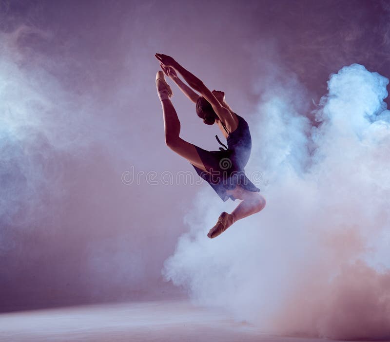 Beautiful young ballet dancer jumping on a lilac royalty free stock photos Beautiful young ballet dancer jumping on a lilac royalty free stock photos