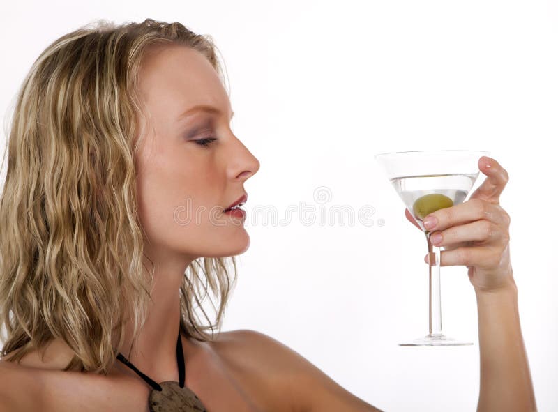 Beautiful young blond woman with a martini drink