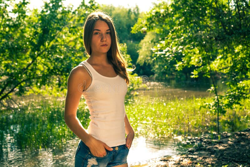 Woman White Tank Top Jean Shorts Stock Photos - Free & Royalty-Free Stock  Photos from Dreamstime