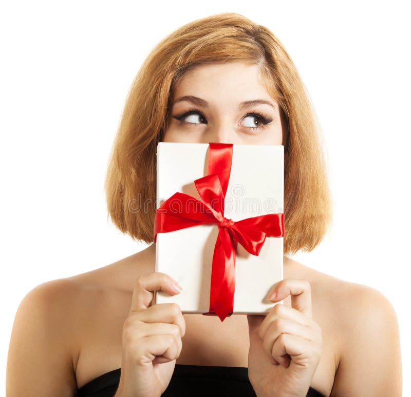 Beautiful young brunette girl holding present