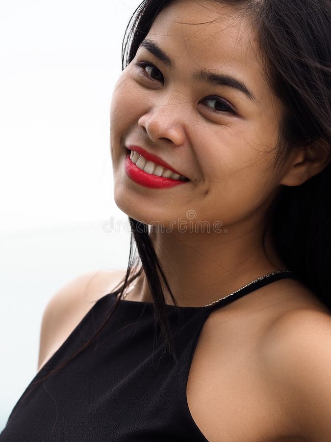 Beautiful young brunette vietnam girl wearing black dress
