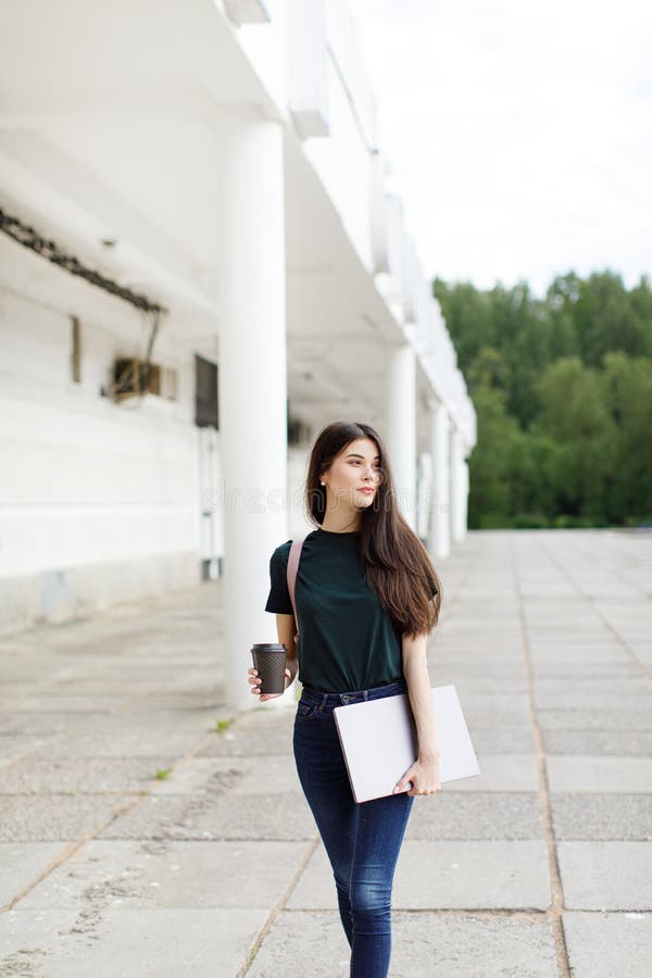 Beautiful Young Brunette Woman Carrying Backpack and Drinking Takeaway ...