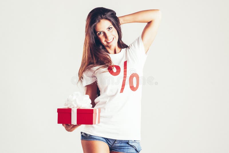 Beautiful young brunette woman with christmas gifts stock photos